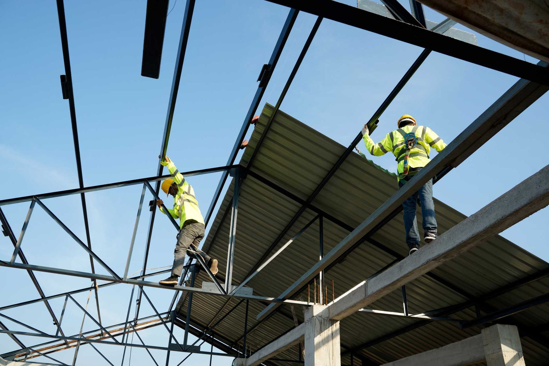 Worker install steel roof — Athens, AL — Alliance Roofing