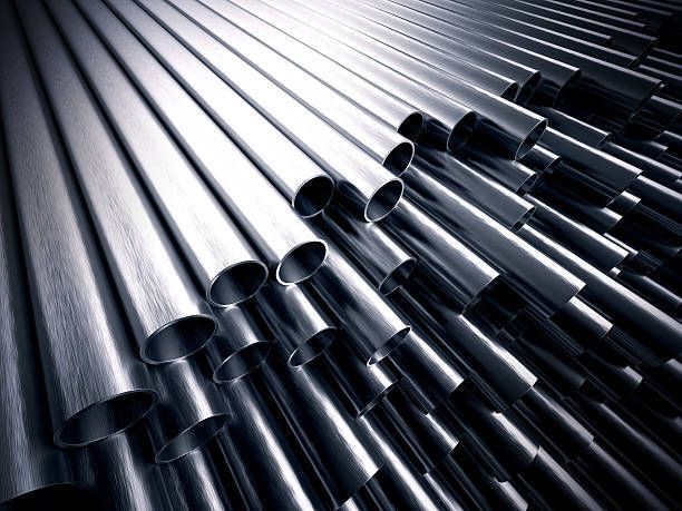 A bunch of metal pipes are stacked on top of each other