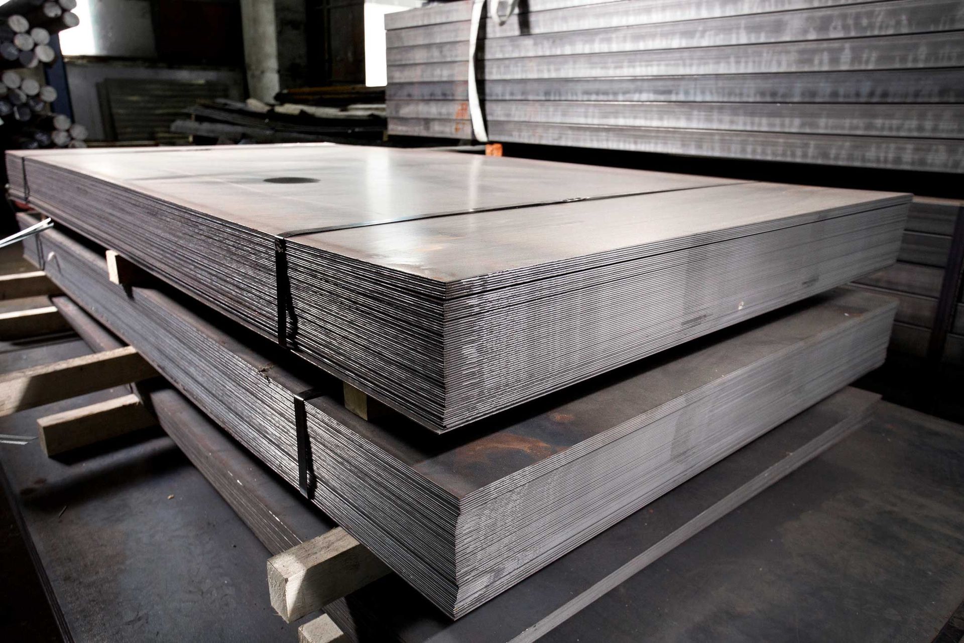 A stack of metal sheets sitting on top of each other on a table.