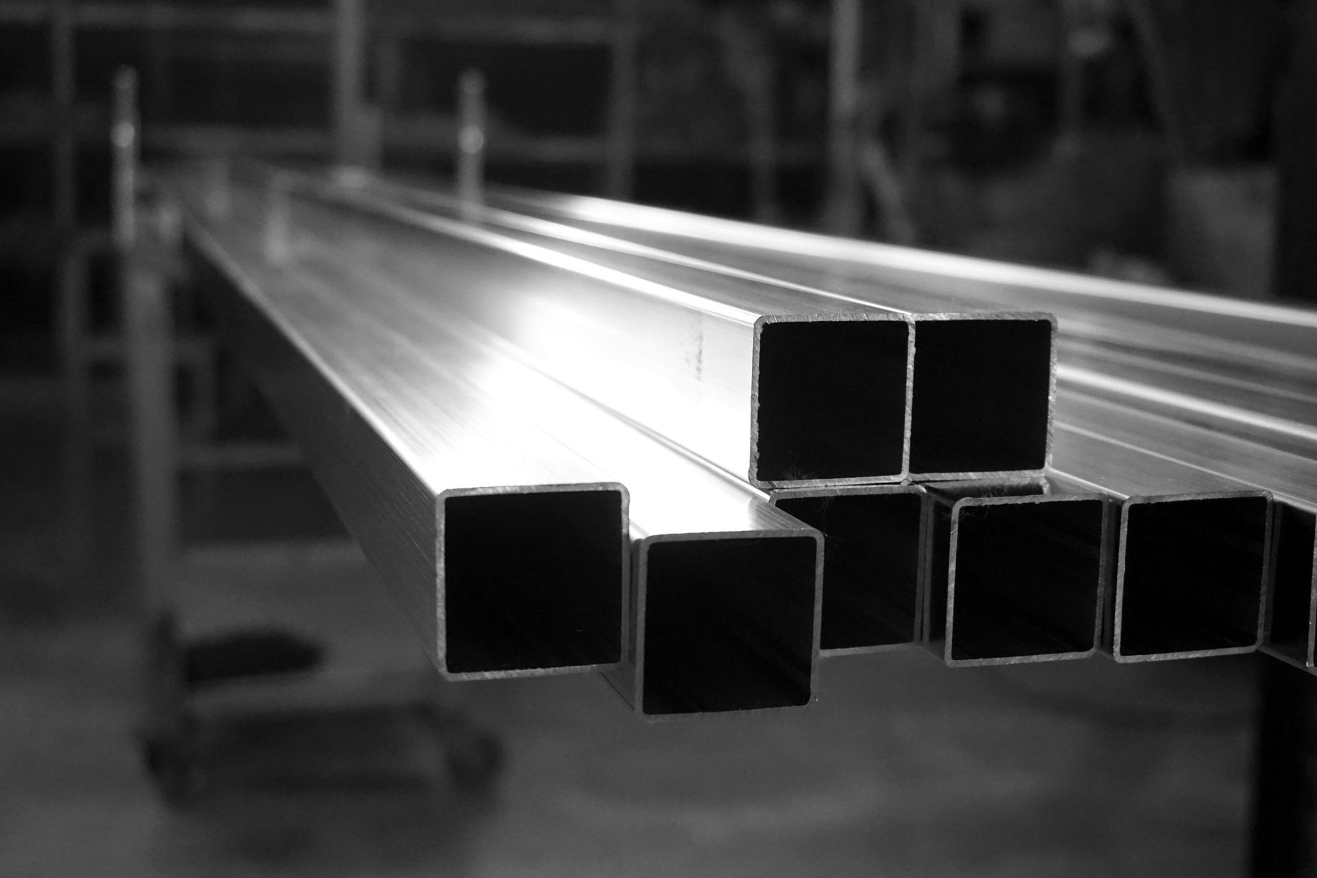 A black and white photo of a stack of metal squares