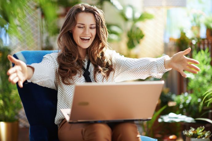 Happy woman on telehealth video call – Dr. Lisa Gengo offers telemedicine functional medicine throughout Connecticut and tri-state area