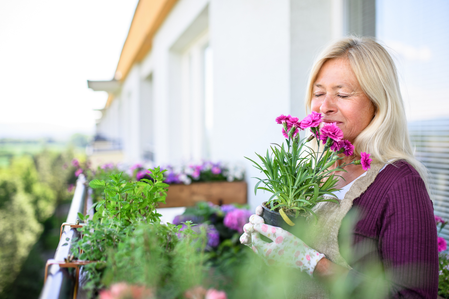 Woman enjoying spring flowers outdoors – spring detox and wellness tips from Dr. Lisa Gengo functional medicine Stamford CT