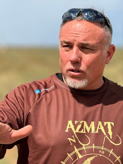 Man in brown shirt with 