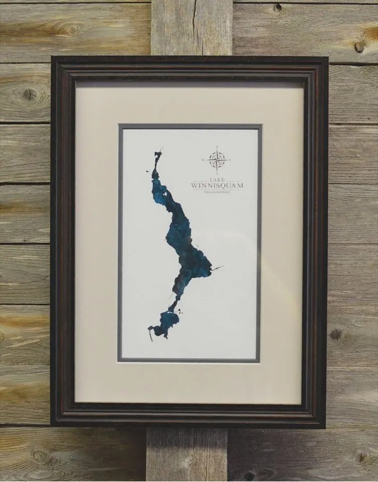 Framed map art of Lake Winnipesaukee in shades of blue.