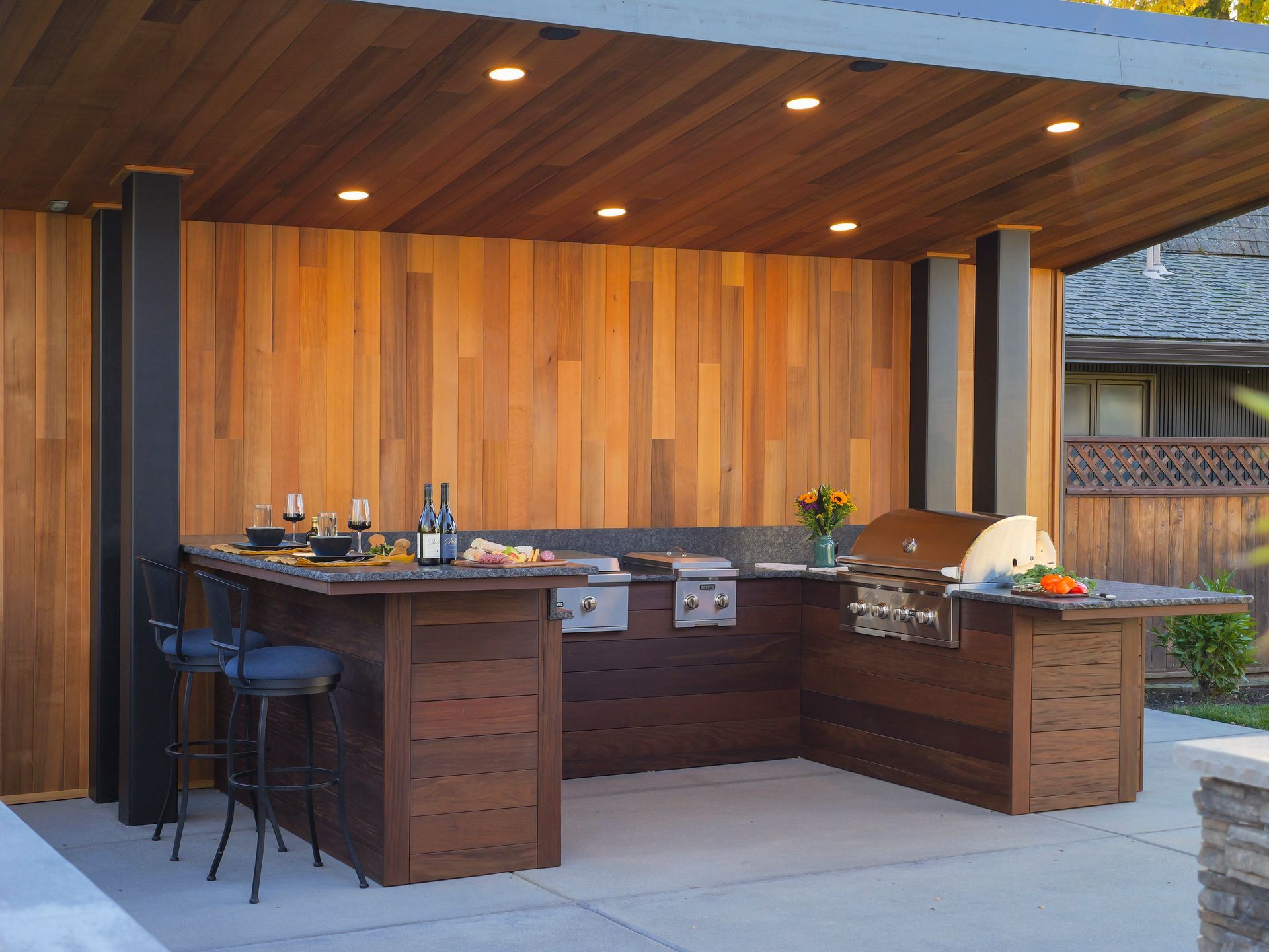 A brand new outdoor kitchen with a custom cantilevered overhead structure in Medford, Oregon.