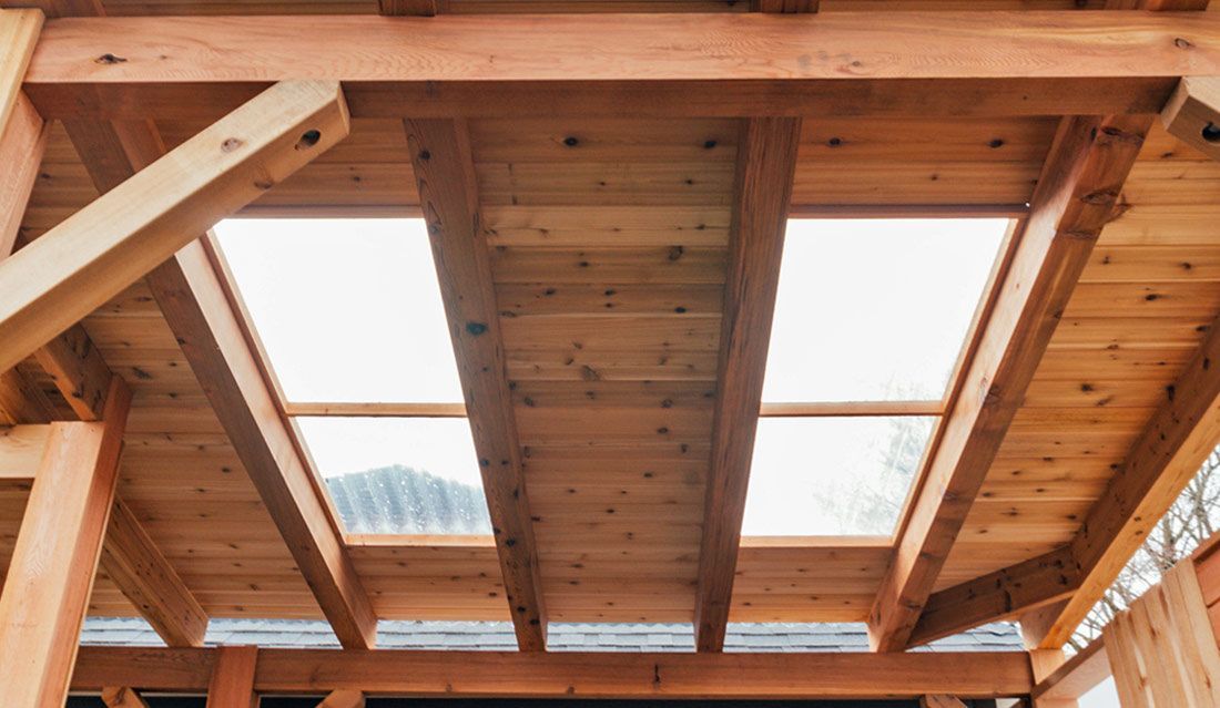 A wooden structure with a skylight in the ceiling.