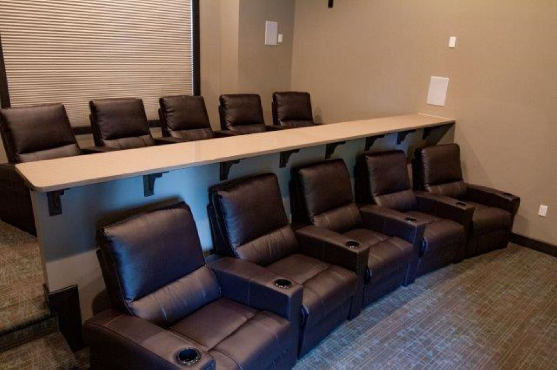 Movie theatre room with rows of chairs