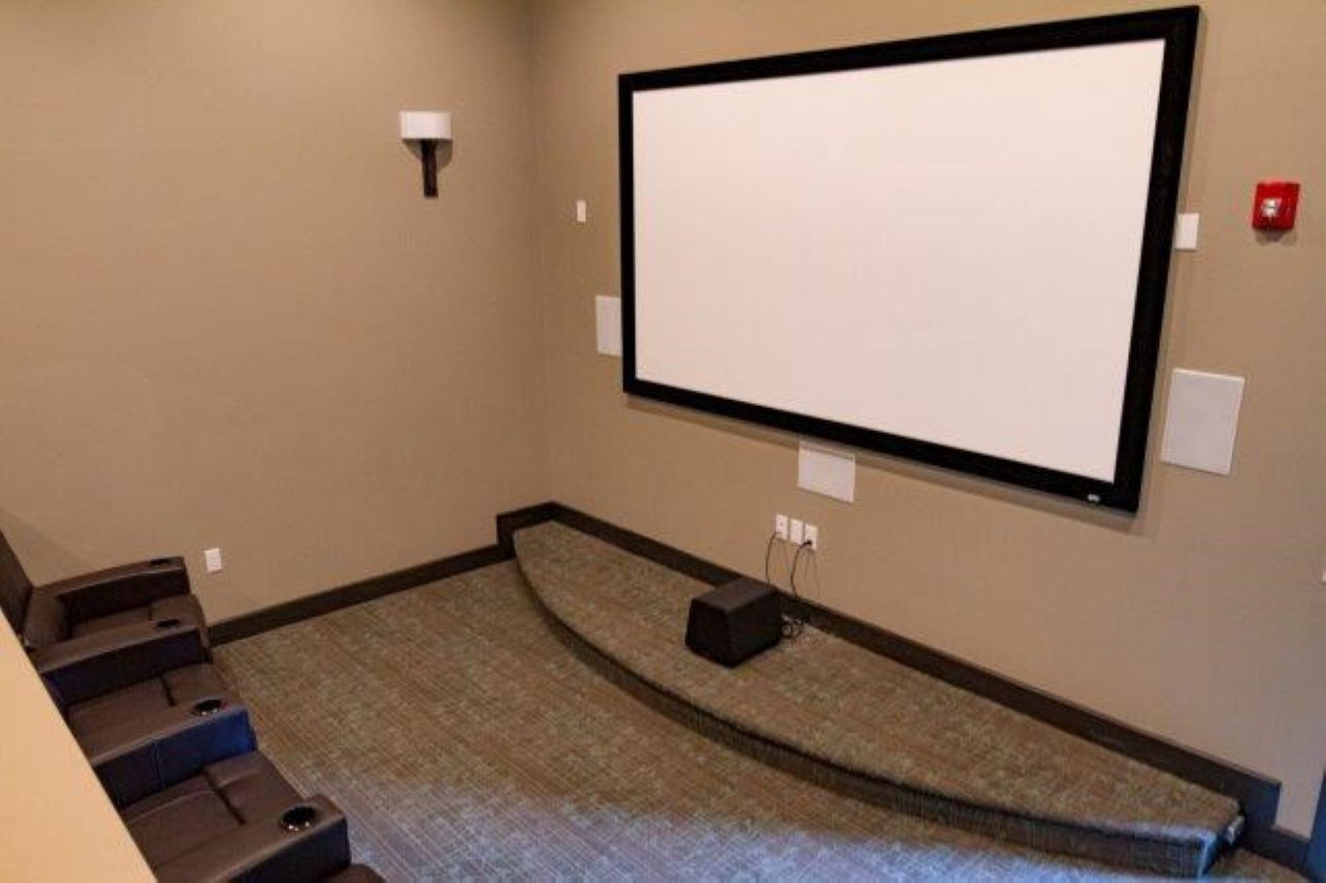 There is a large screen in the middle of the room.