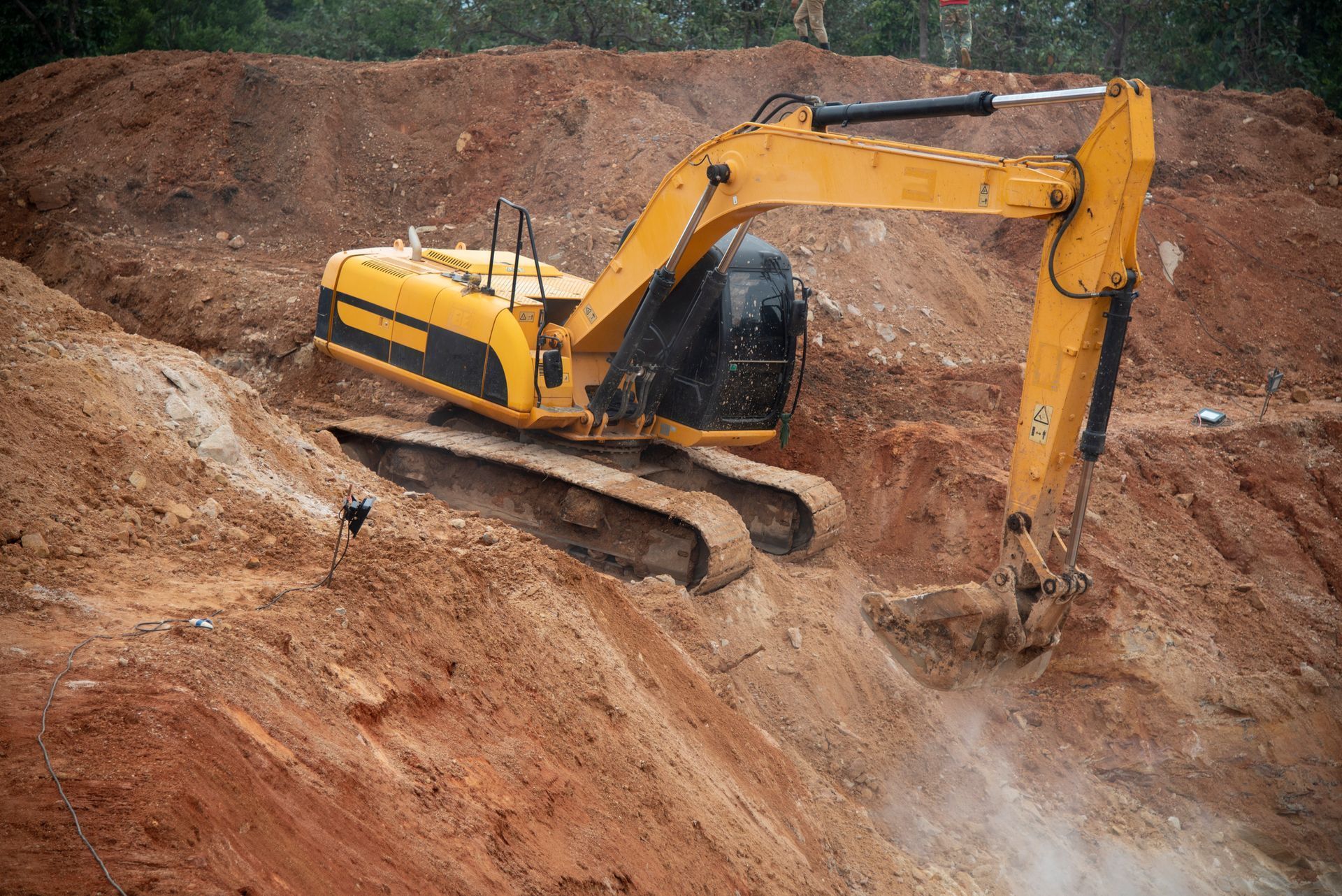 A Yellow Excavator Digging.