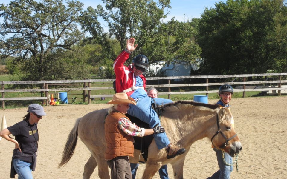 A man is riding on the back of a donkey