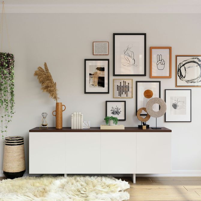 Minimalist console table with framed art and decor in a bright living room