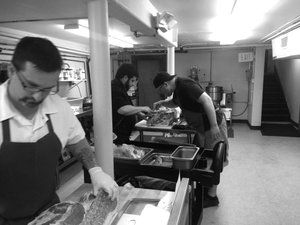 people in commercial kitchen 