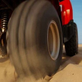ATV Tire Rolling in the Sand