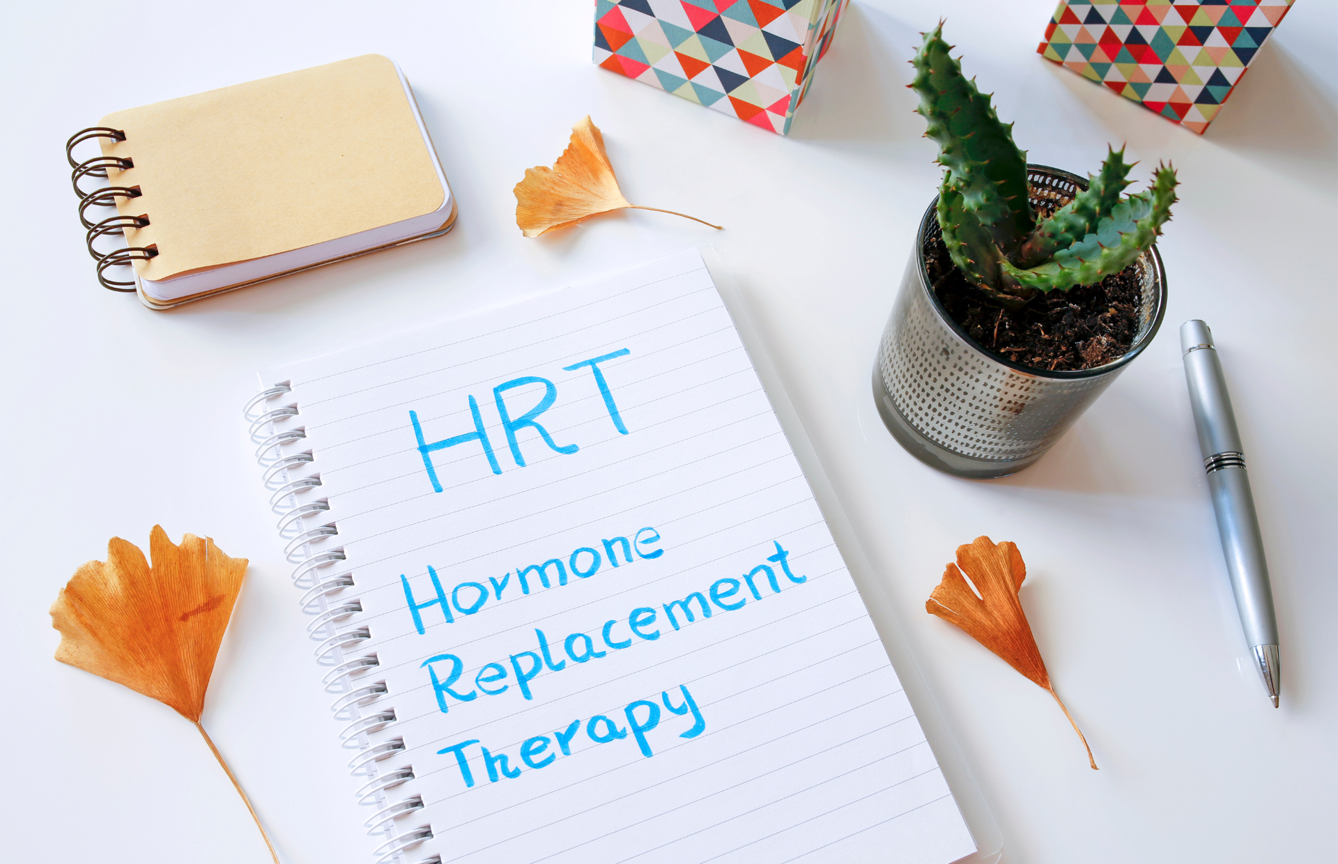 A notebook with the words `` hrt hormone replacement therapy '' written on it.