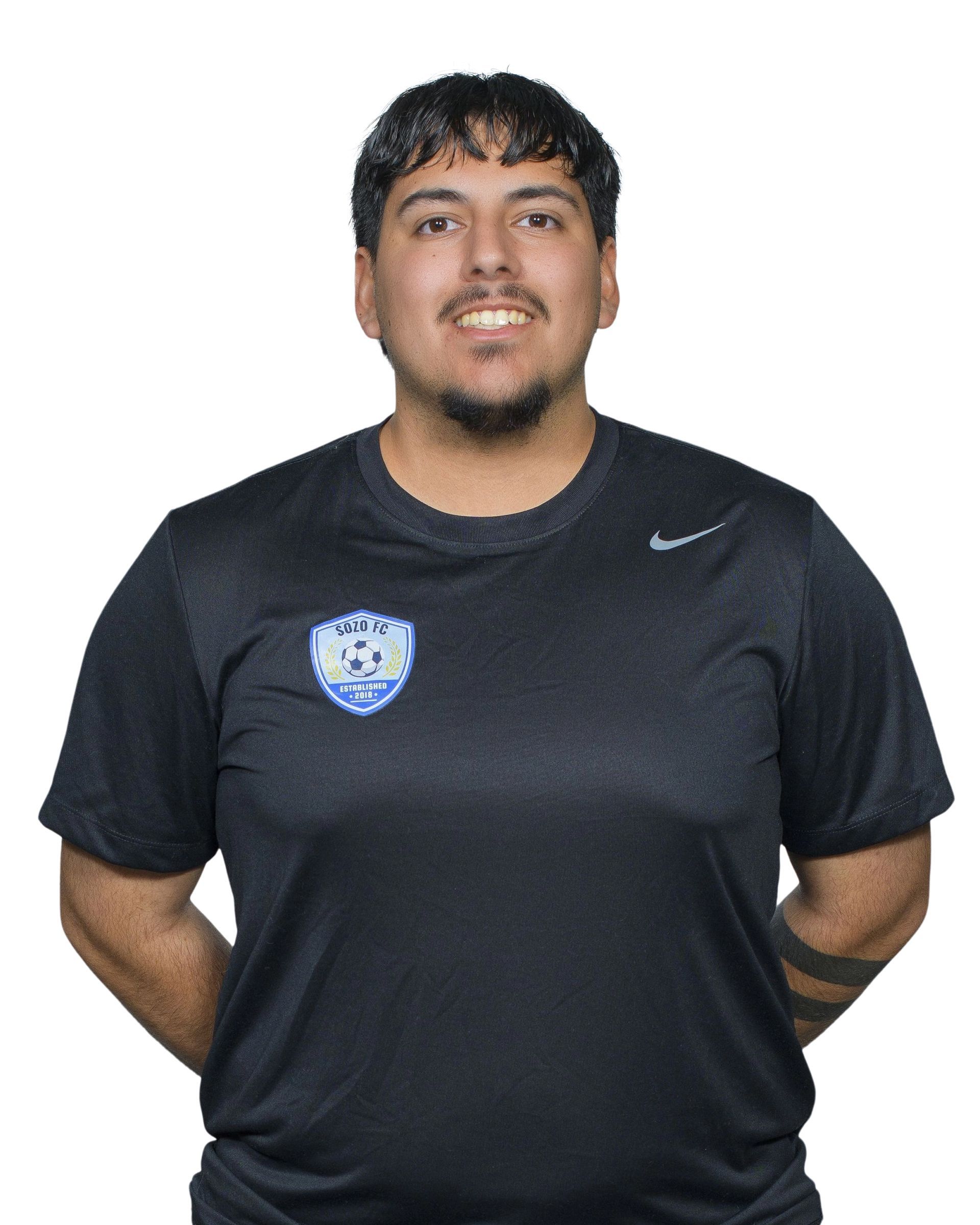 A man wearing a grey shirt with the word capelli on it