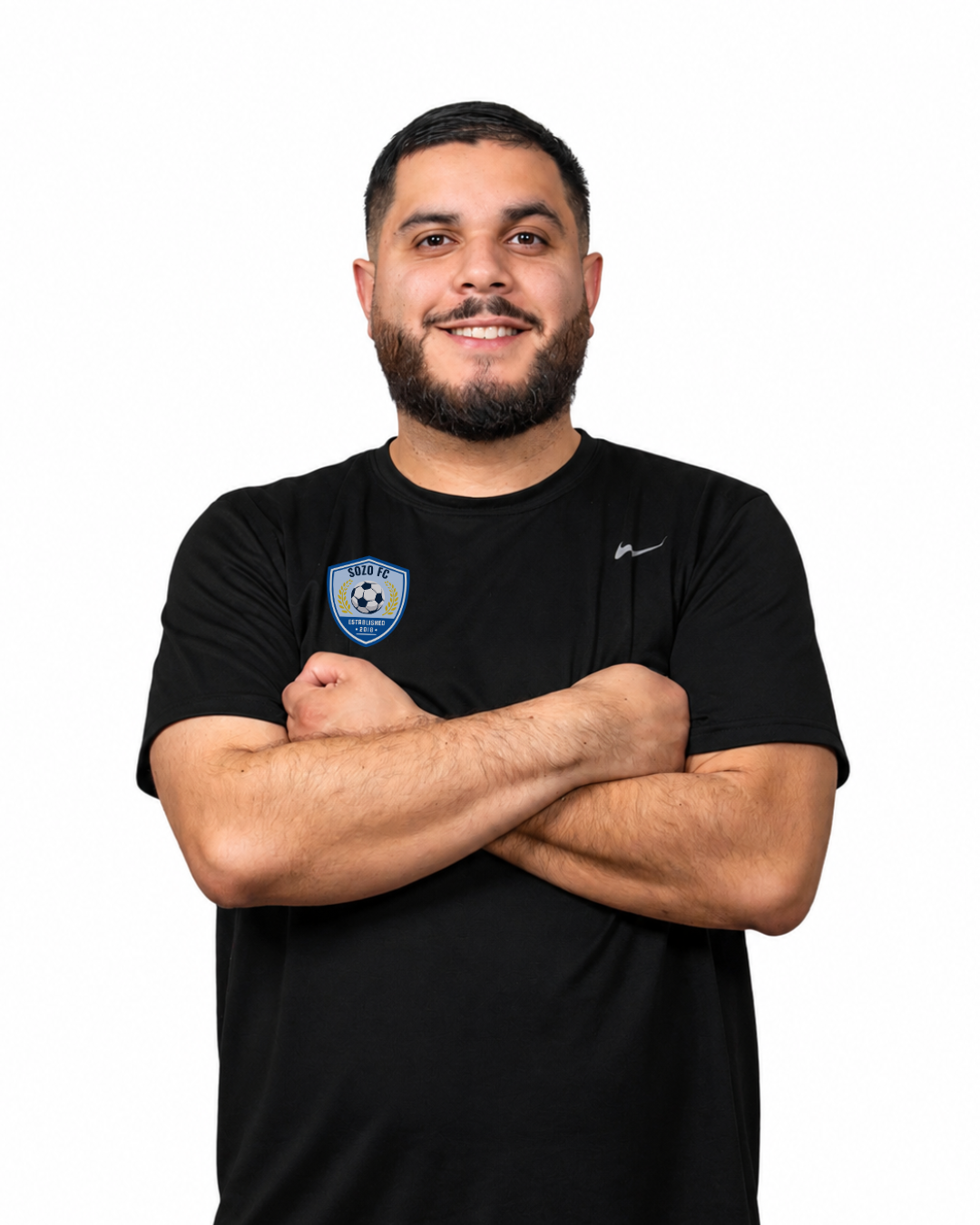 Man standing with arms crossed, wearing a black T-shirt against a white background.