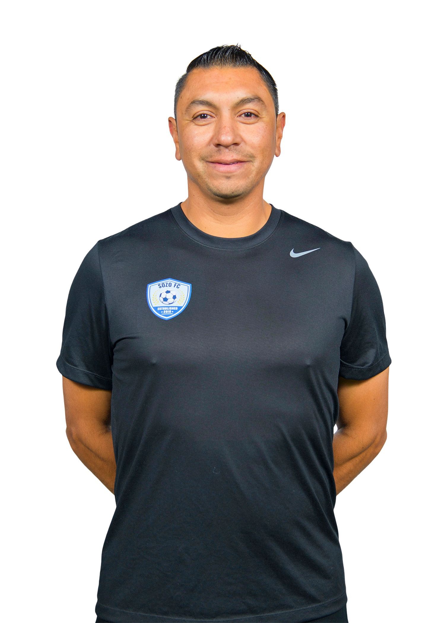 A man wearing a grey shirt with the word capell on it