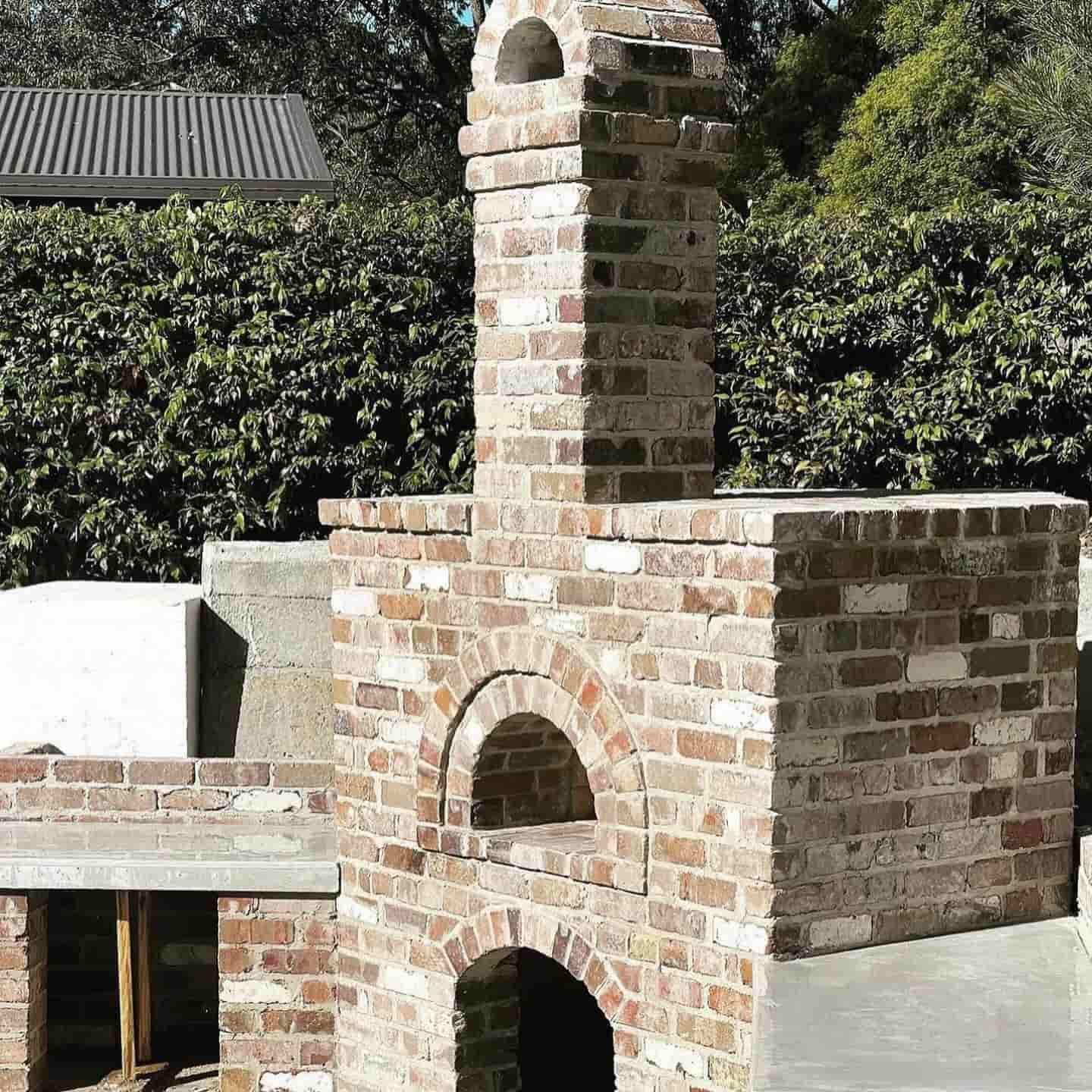 A brick oven with a chimney on top of it — Premier Bricks, Blocks & Pavers In Heatherbrae, NSW
