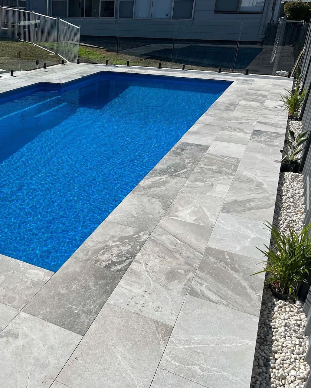 Atlantic grey pavers around a pool— Premier Bricks, Blocks & Pavers In Heatherbrae, NSW