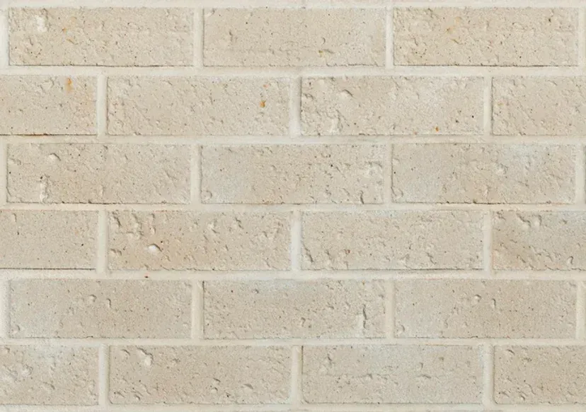 Tan brick wall with white mortar — Premier Bricks, Blocks & Pavers In Heatherbrae, NSW