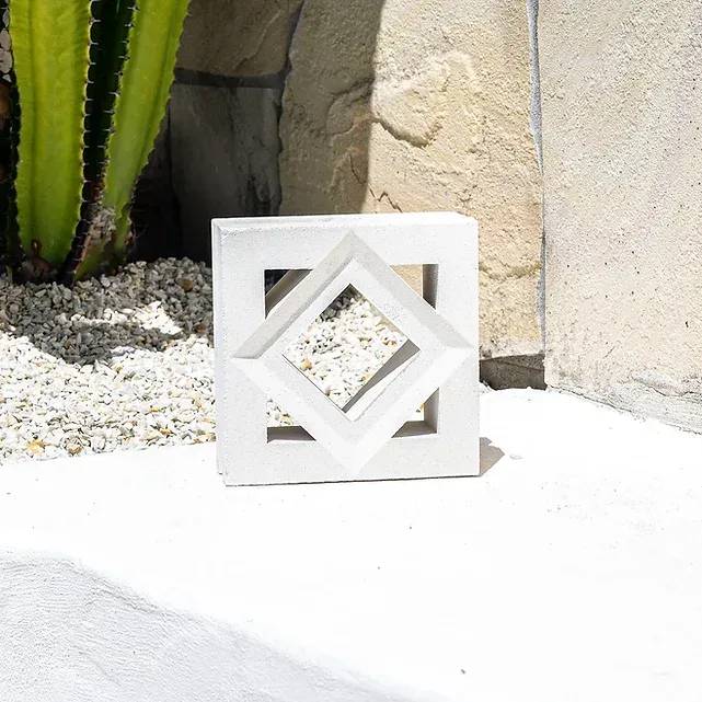 White square concrete block with diamond-shaped cutout — Premier Bricks, Blocks & Pavers In Heatherbrae, NSW