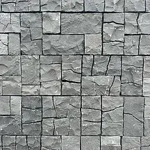 Gray stone block wall with uneven, textured surfaces — Premier Bricks, Blocks & Pavers In Heatherbrae, NSW