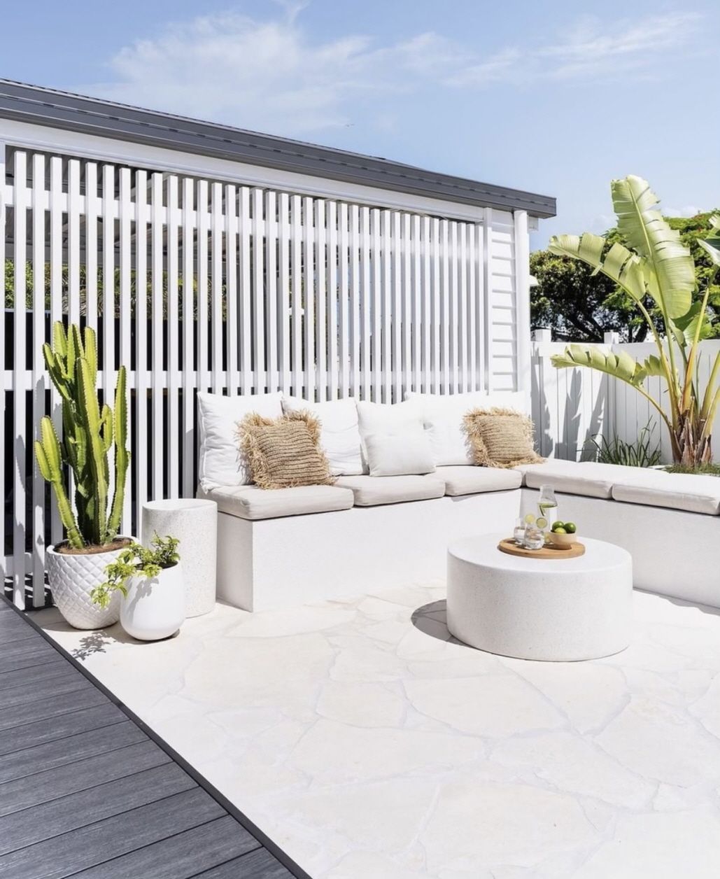 White outdoor patio with built-in seating — Premier Bricks, Blocks & Pavers In Heatherbrae, NSW