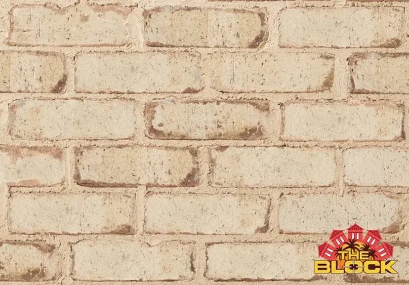Light beige brick wall with darker brown mortar, and 