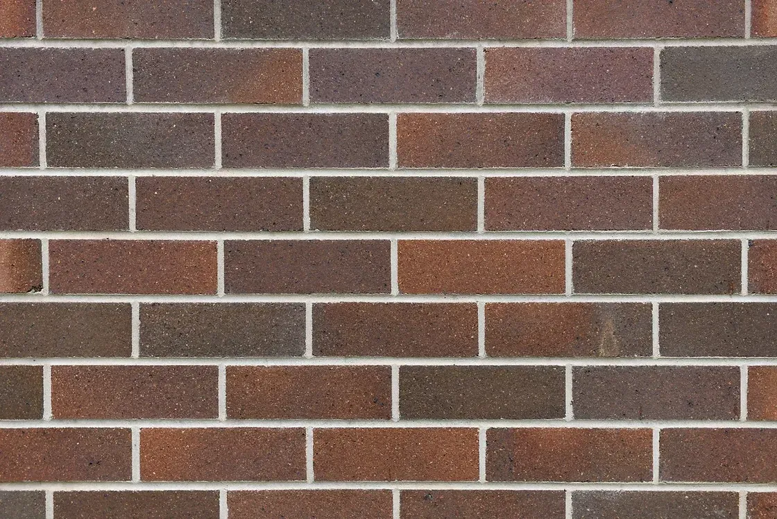 Brick wall with red-brown bricks and white mortar — Premier Bricks, Blocks & Pavers In Heatherbrae, NSW