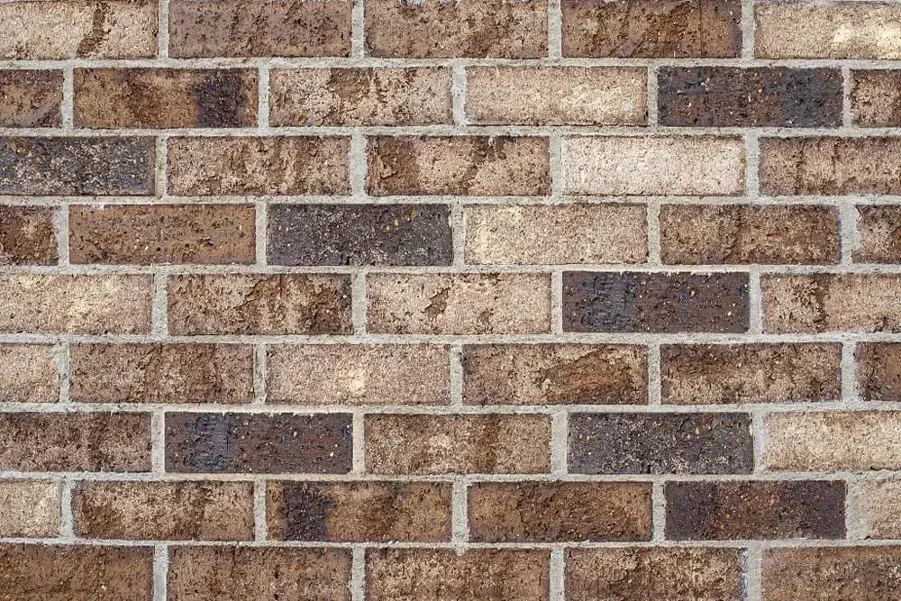 Brick wall with varying shades mortared together — Premier Bricks, Blocks & Pavers In Heatherbrae, NSW
