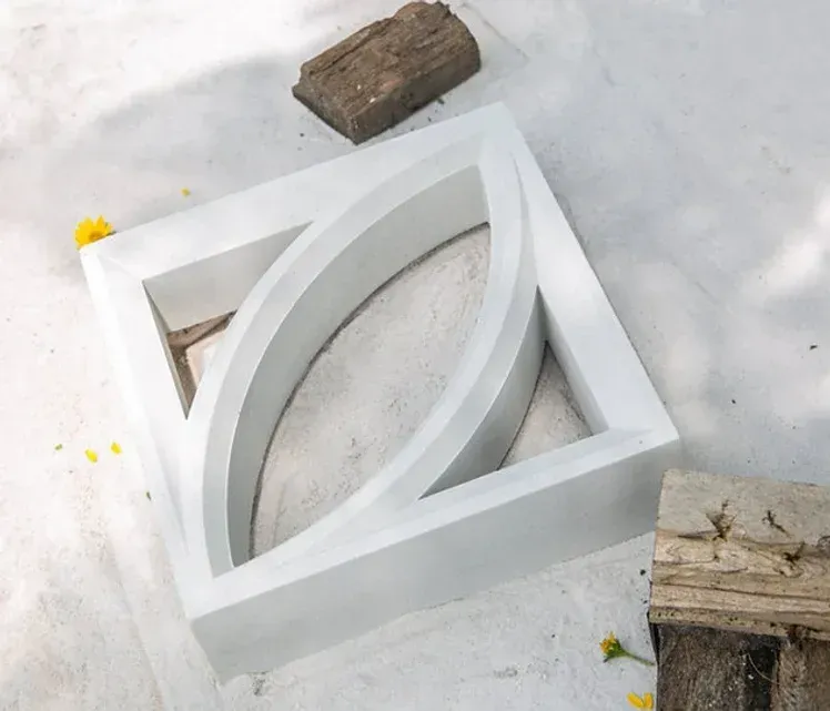 White square concrete block with curved design — Premier Bricks, Blocks & Pavers In Heatherbrae, NSW