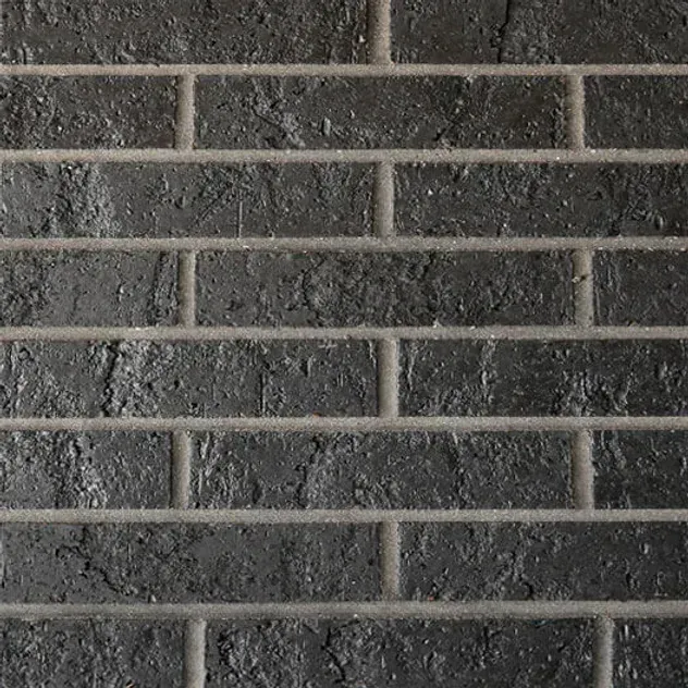 Dark gray brick wall with light gray mortar lines — Premier Bricks, Blocks & Pavers In Heatherbrae, NSW