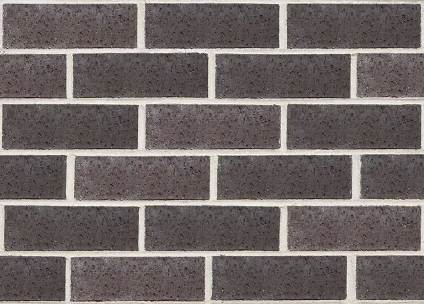 Dark gray brick wall with white mortar — Premier Bricks, Blocks & Pavers In Heatherbrae, NSW