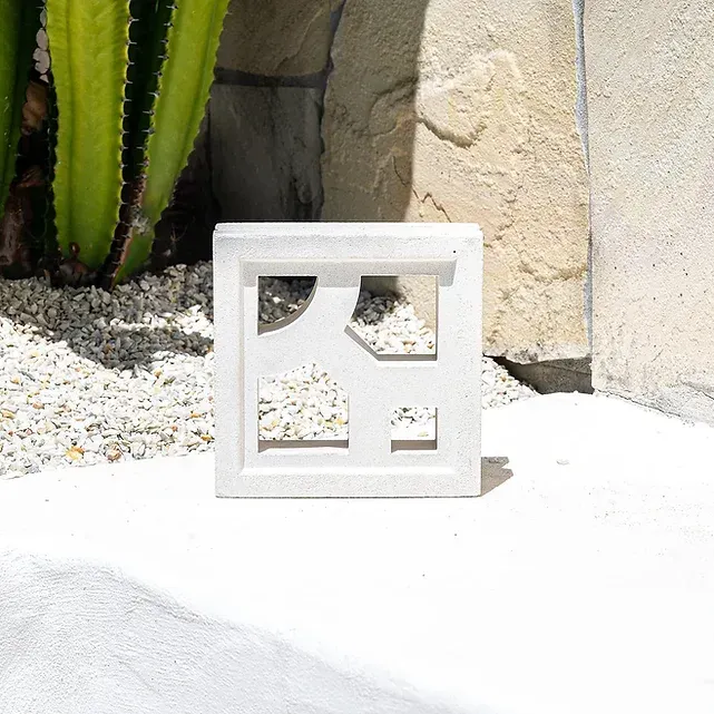 White square concrete block with cut-out shapes — Premier Bricks, Blocks & Pavers In Heatherbrae, NSW
