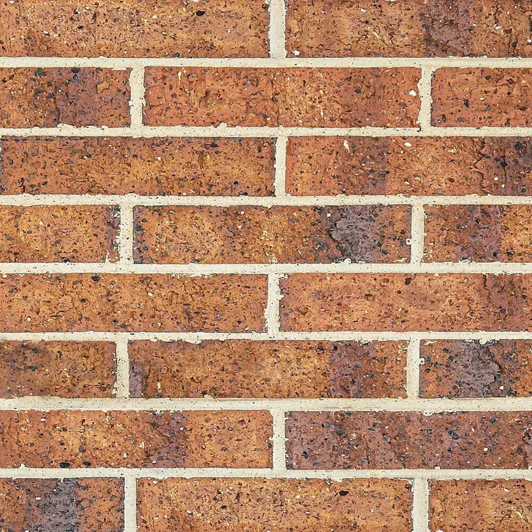 Close-up of a brick wall with red-brown bricks and light-colored mortar — Premier Bricks, Blocks & Pavers In Heatherbrae, NSW