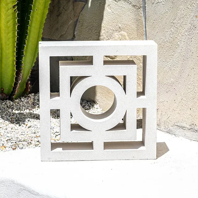 Square, white concrete decorative block with geometric cutouts  — Premier Bricks, Blocks & Pavers In Heatherbrae, NSW