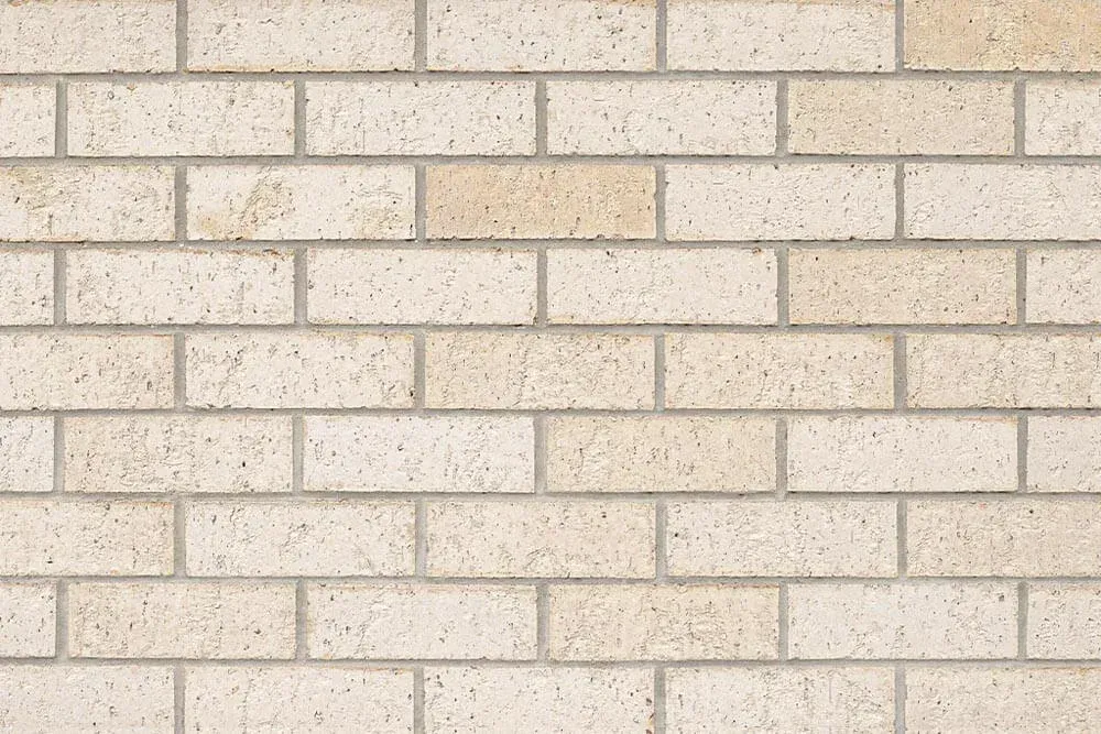 Cream-colored brick wall with visible mortar joints — Premier Bricks, Blocks & Pavers In Heatherbrae, NSW