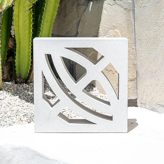 White concrete block with decorative cutout, outdoors — Premier Bricks, Blocks & Pavers In Heatherbrae, NSW