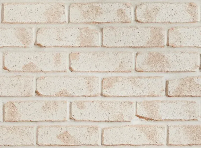Close-up of a white brick wall with brown-toned, speckled bricks — Premier Bricks, Blocks & Pavers In Heatherbrae, NSW