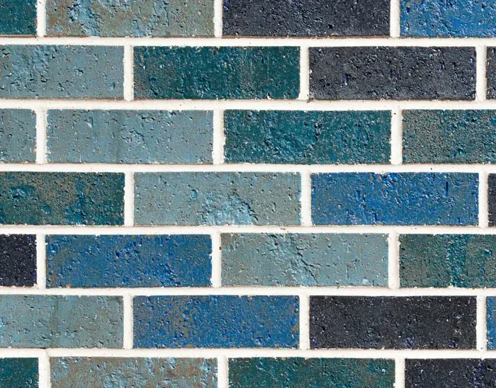 Blue and teal brick wall with white mortar — Premier Bricks, Blocks & Pavers In Heatherbrae, NSW