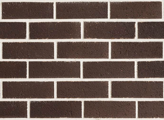 Dark brown brick wall with white mortar — Premier Bricks, Blocks & Pavers In Heatherbrae, NSW