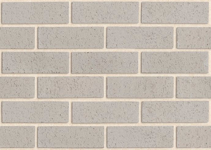 Light grey brick wall with off-white mortar joints — Premier Bricks, Blocks & Pavers In Heatherbrae, NSW