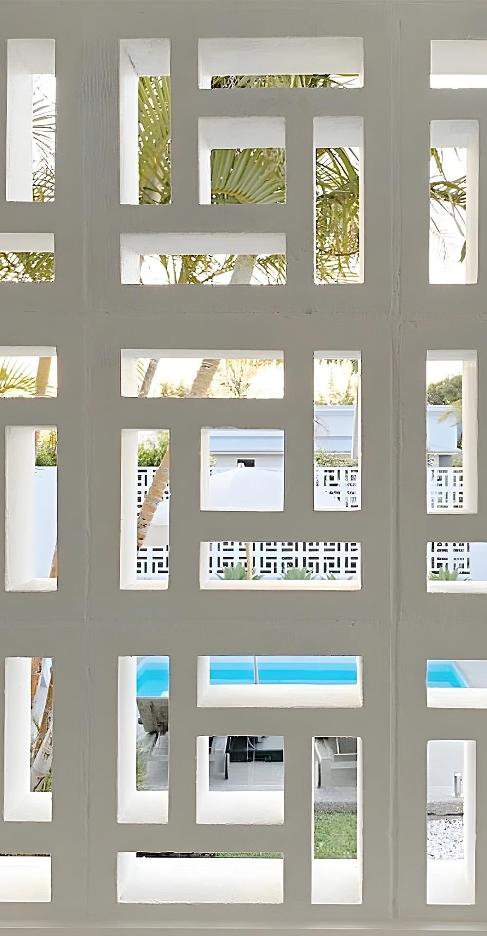 A Wall With A Lot Of Windows And A Pool In The Background — Premier Bricks, Blocks & Pavers In Maitland, NSW