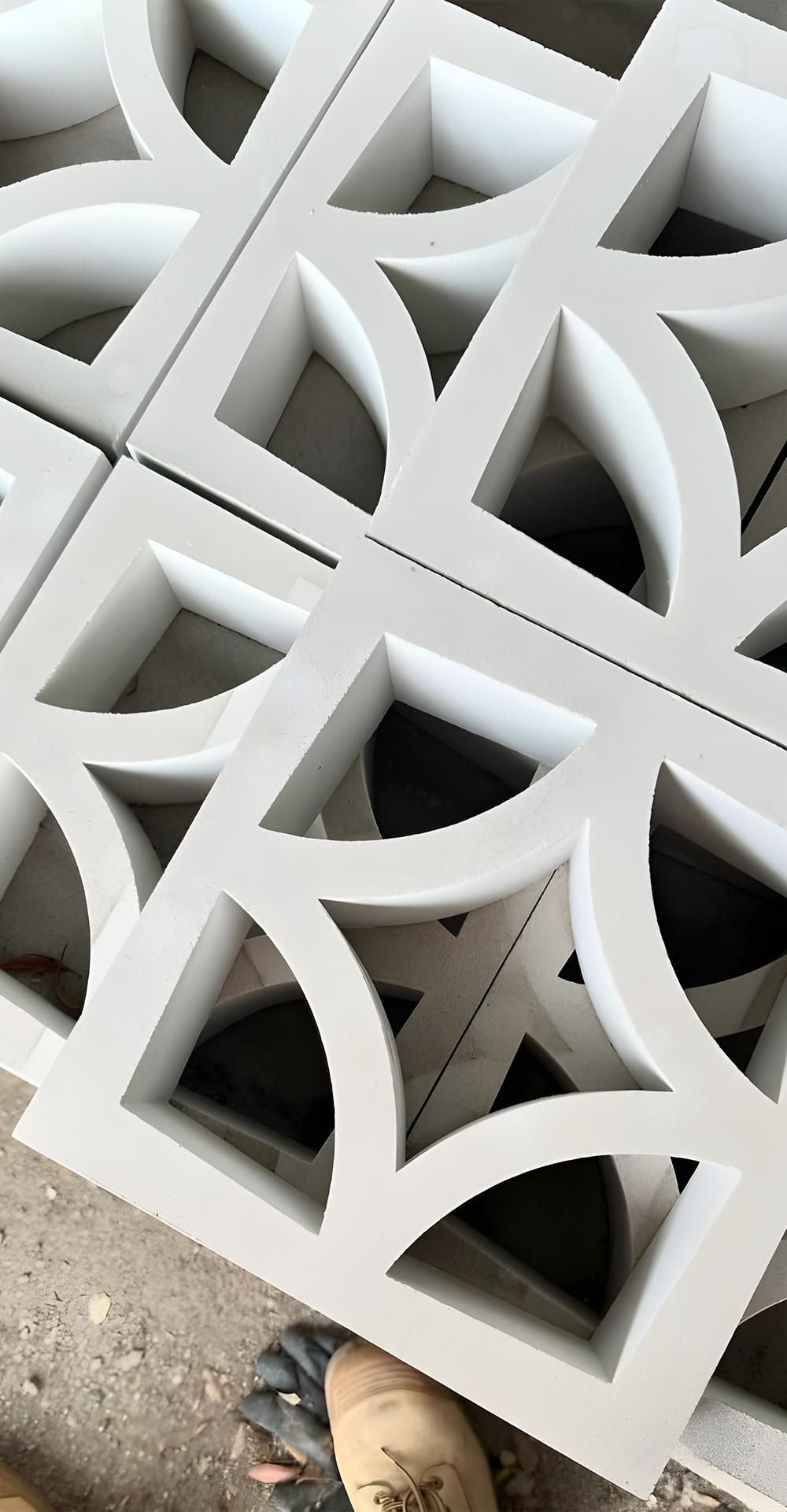 A Close Up Of A White Wall With A Pattern On It — Premier Bricks, Blocks & Pavers In Newcastle, NSW