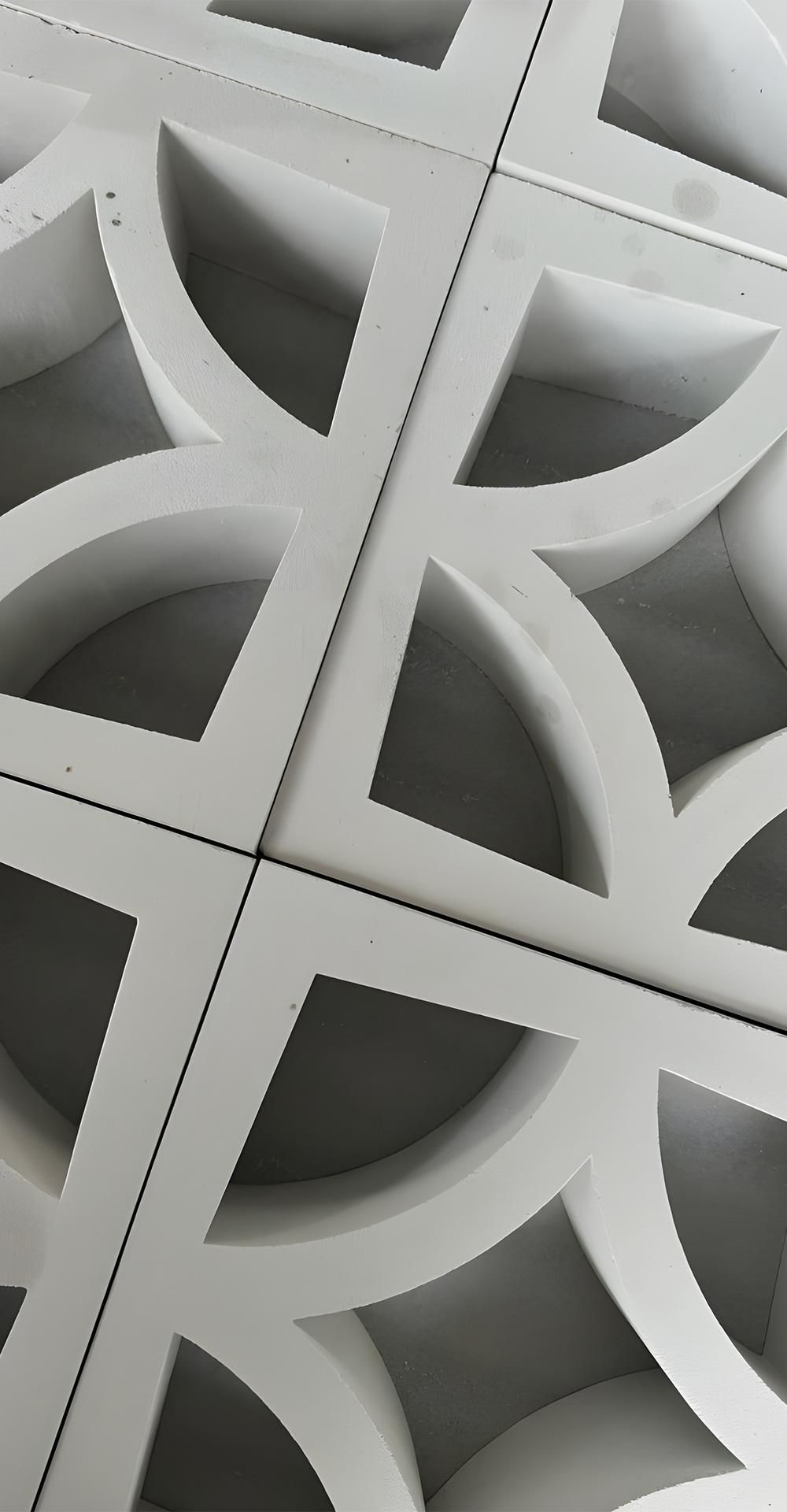 A Close Up Of A White Geometric Pattern On A Wall — Premier Bricks, Blocks & Pavers In Heatherbrae, NSW