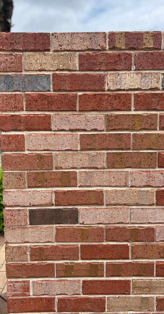 A Close Up Of A Brick Wall With A Few Bricks Missing — Premier Bricks, Blocks & Pavers In Singleton, NSW