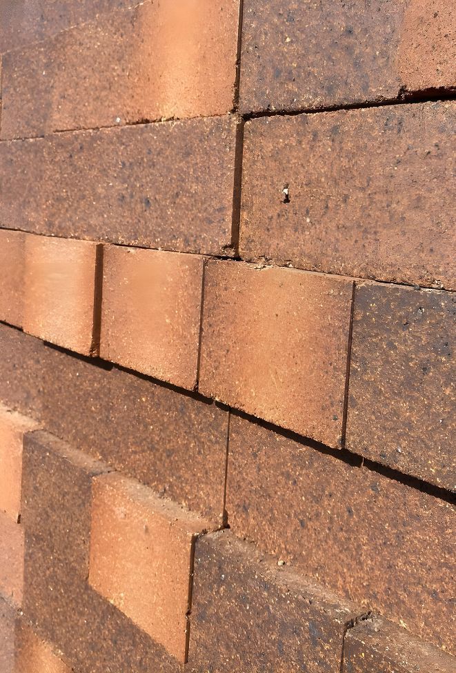 A Close Up Of A Brick Wall With Bricks Stacked On Top Of Each Other — Premier Bricks, Blocks & Pavers In Maitland, NSW