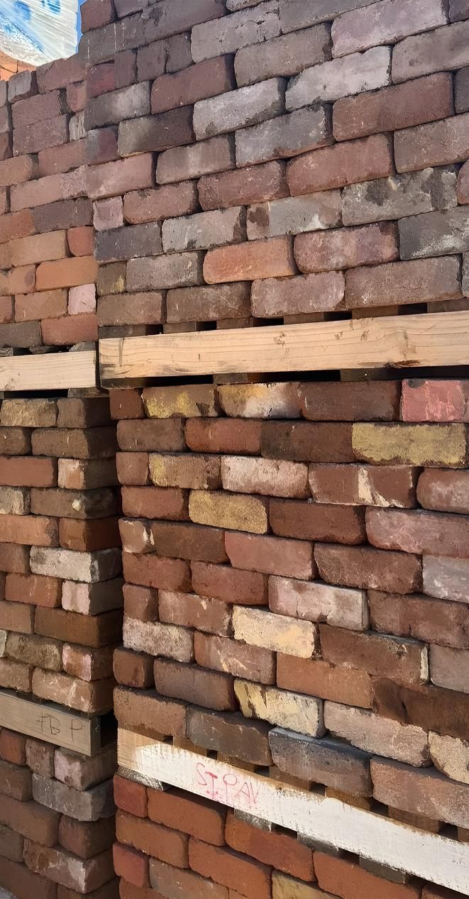 A Pile Of Bricks Stacked On Top Of Each Other On Wooden Pallets — Premier Bricks, Blocks & Pavers In Lake Macquarie, NSW