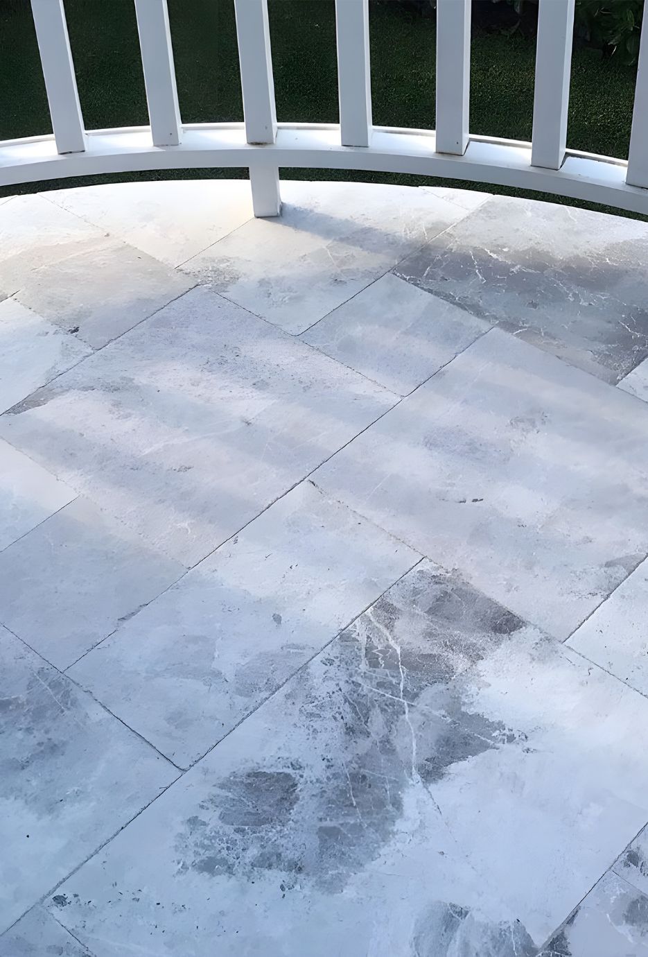 A White Tile Floor With A White Railing In The Background — Premier Bricks, Blocks & Pavers In Port Stephens, NSW