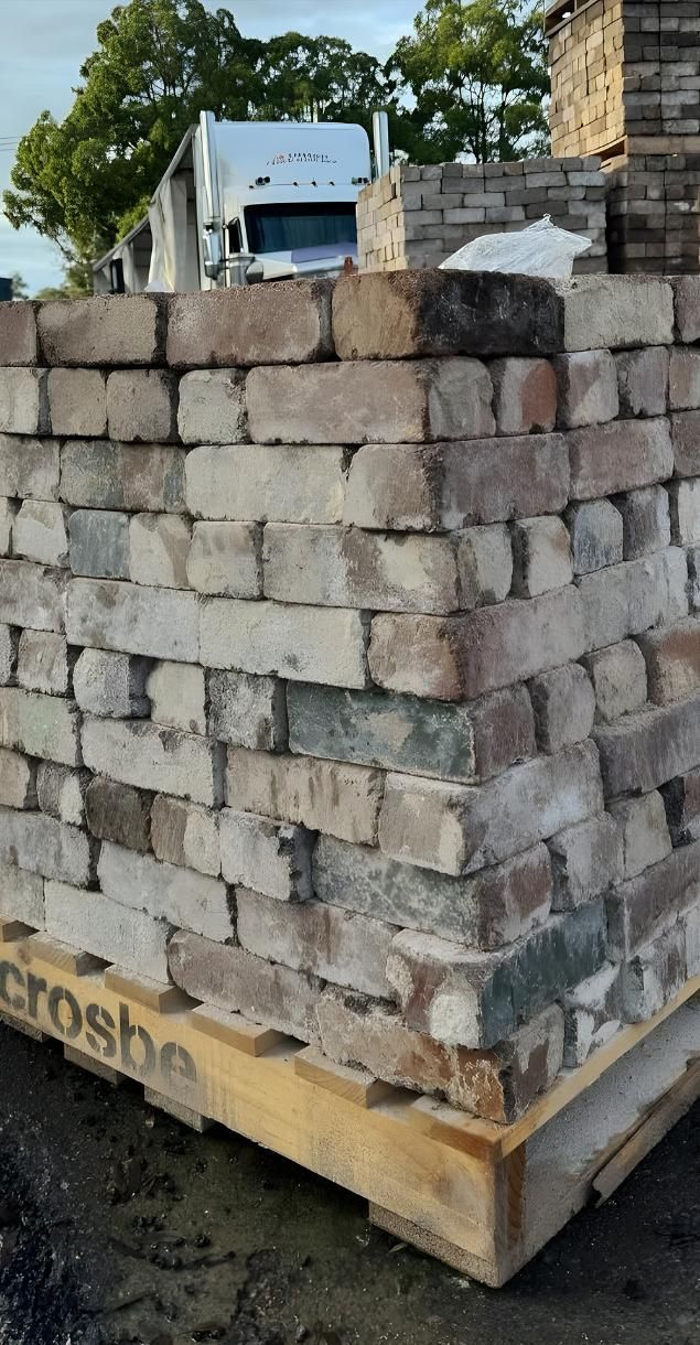 A Pile Of Bricks Sitting On Top Of A Wooden Pallet — Premier Bricks, Blocks & Pavers In Newcastle, NSW